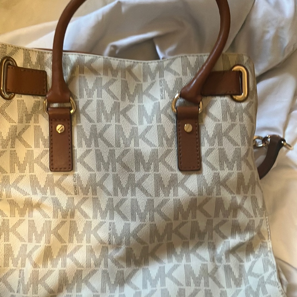 MK , monogrammed tan tote bag , gold details . Used great condition.